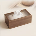 Wooden tissue box close-up on cream surface