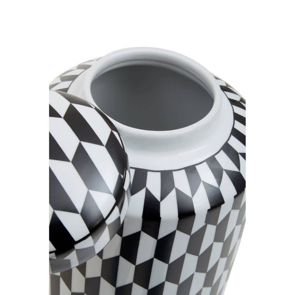 Geometric monochrome ceramic ginger jar styled on dark sideboard with gold accents
