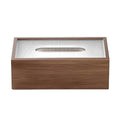 Wooden tissue box on round side table with chair