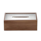 Wooden tissue box on round side table with chair