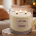 White Cotton candle lit in a cosy living room setting