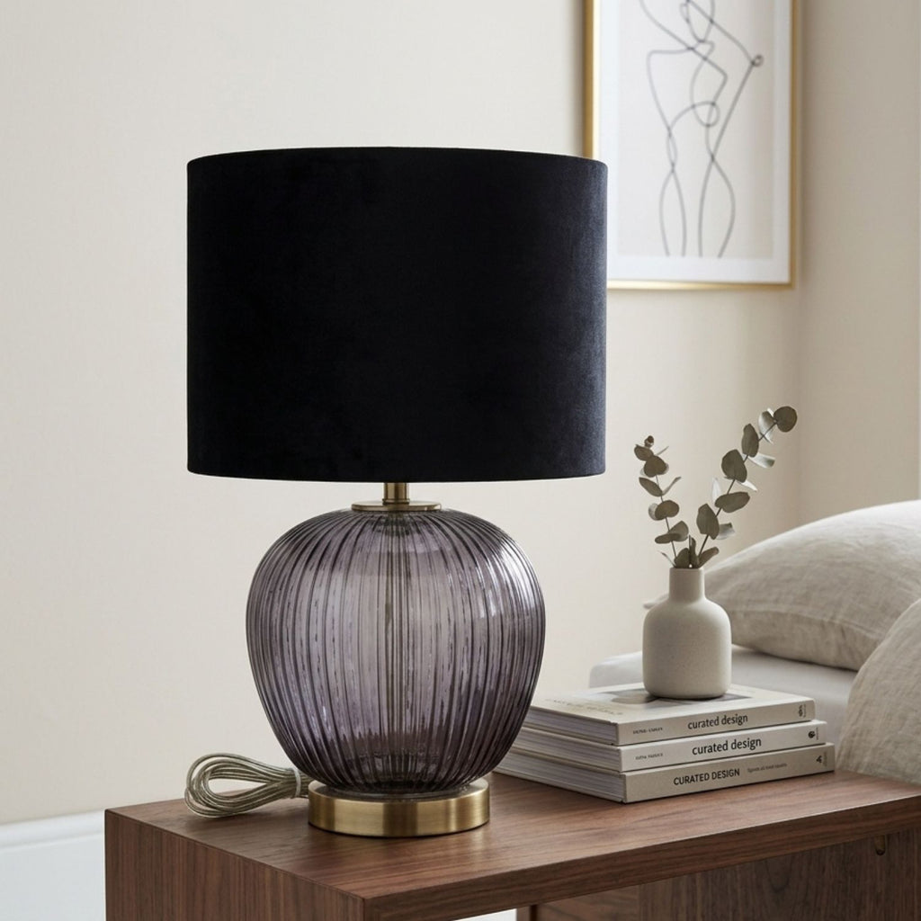 Close-up of the Luxton lamp smoky ribbed base and metallic-coloured foot