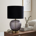 Close-up of the Luxton lamp smoky ribbed base and metallic-coloured foot
