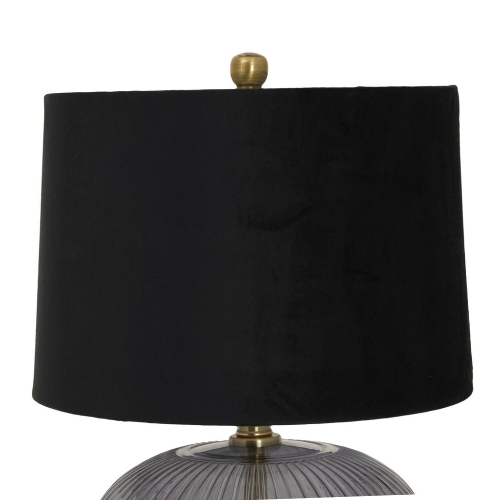 Luxton table lamp with black shade and smoky ribbed base on a bedside table
