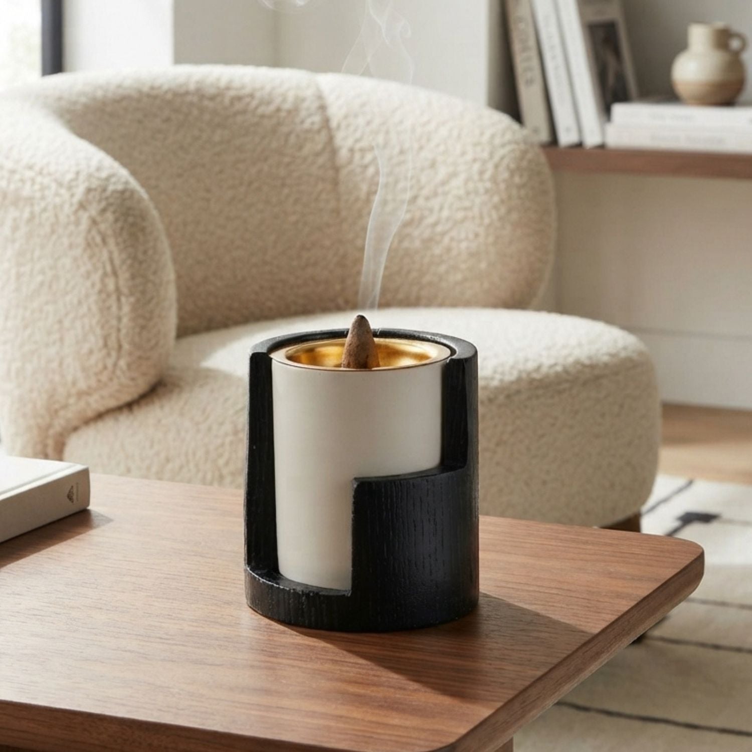 Black and white incense burner with incense cone in a living room