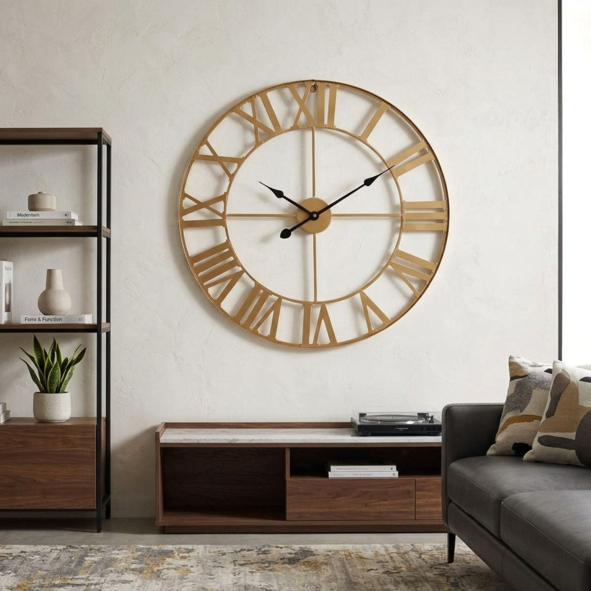 A large round wall clock with a natural wood frame and Roman numerals hangs on a textured off-white wall in a modern living room setting.
