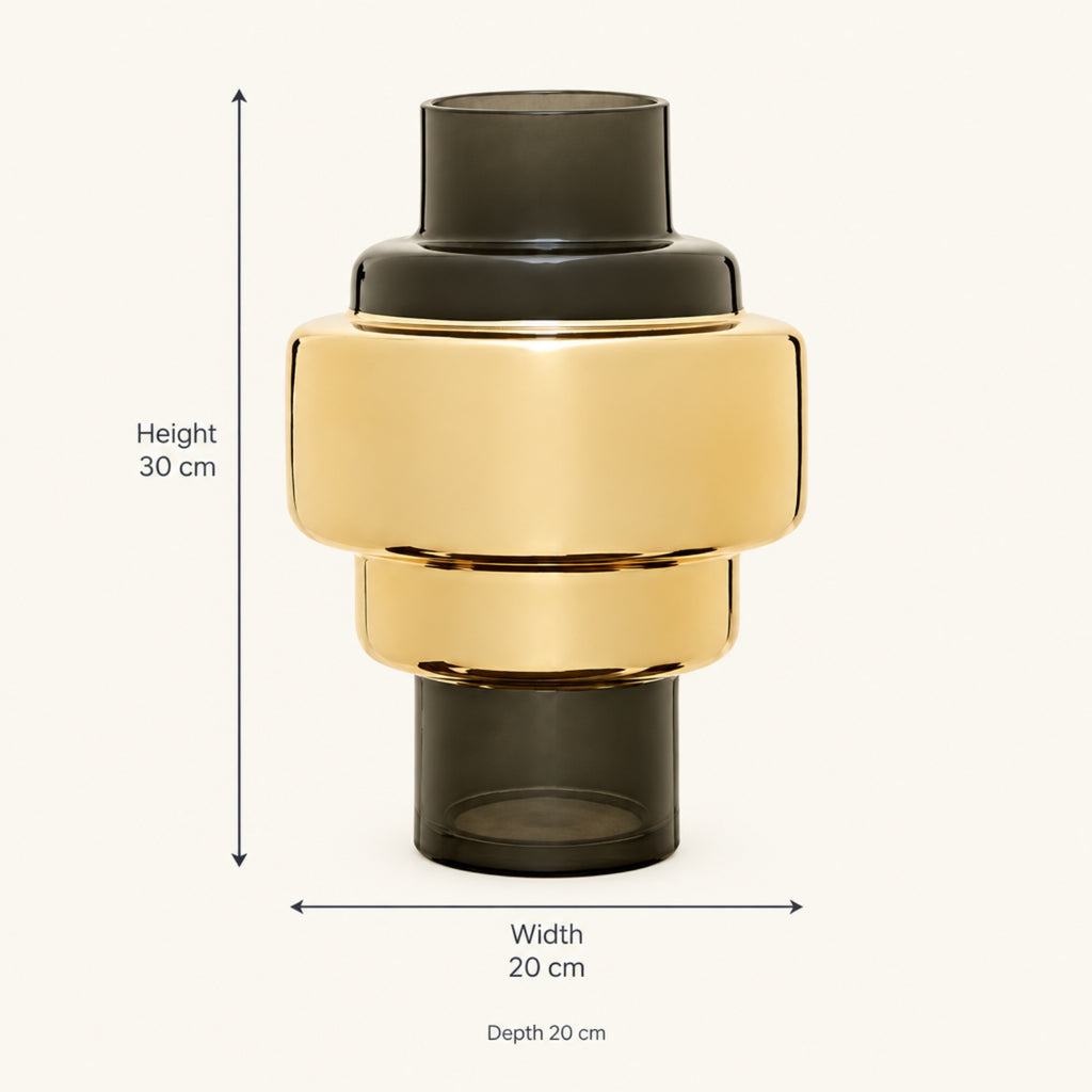 A modern cylindrical vase with a glossy gold middle section and dark smoky gray top and bottom sections, shown with dimension arrows and text indicating height 30 cm, width 20 cm, and depth 20 cm on a light beige background.