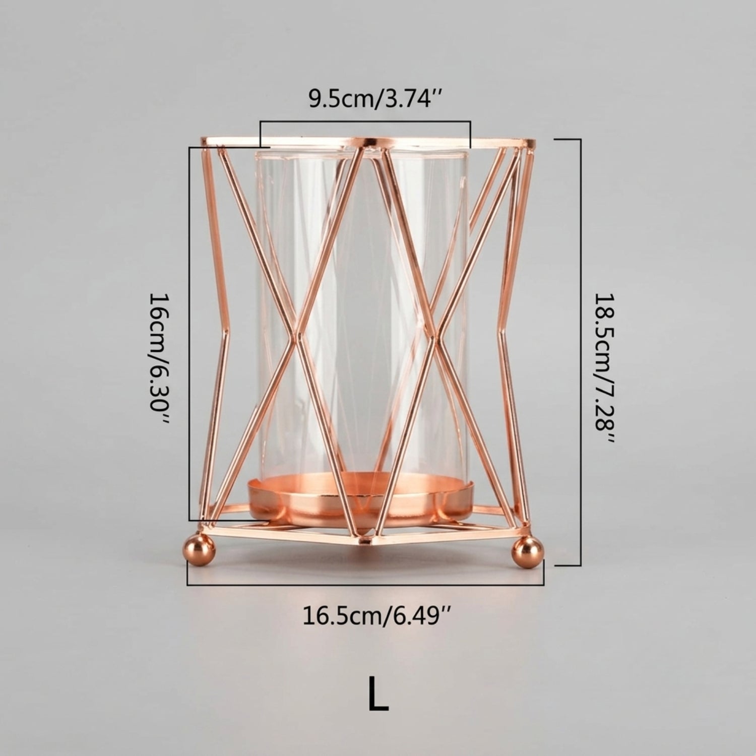 Rose gold metal candle holder with a clear glass cylinder and geometric wireframe design, shown with dimension labels indicating 16cm height, 18.5cm overall height, 9.