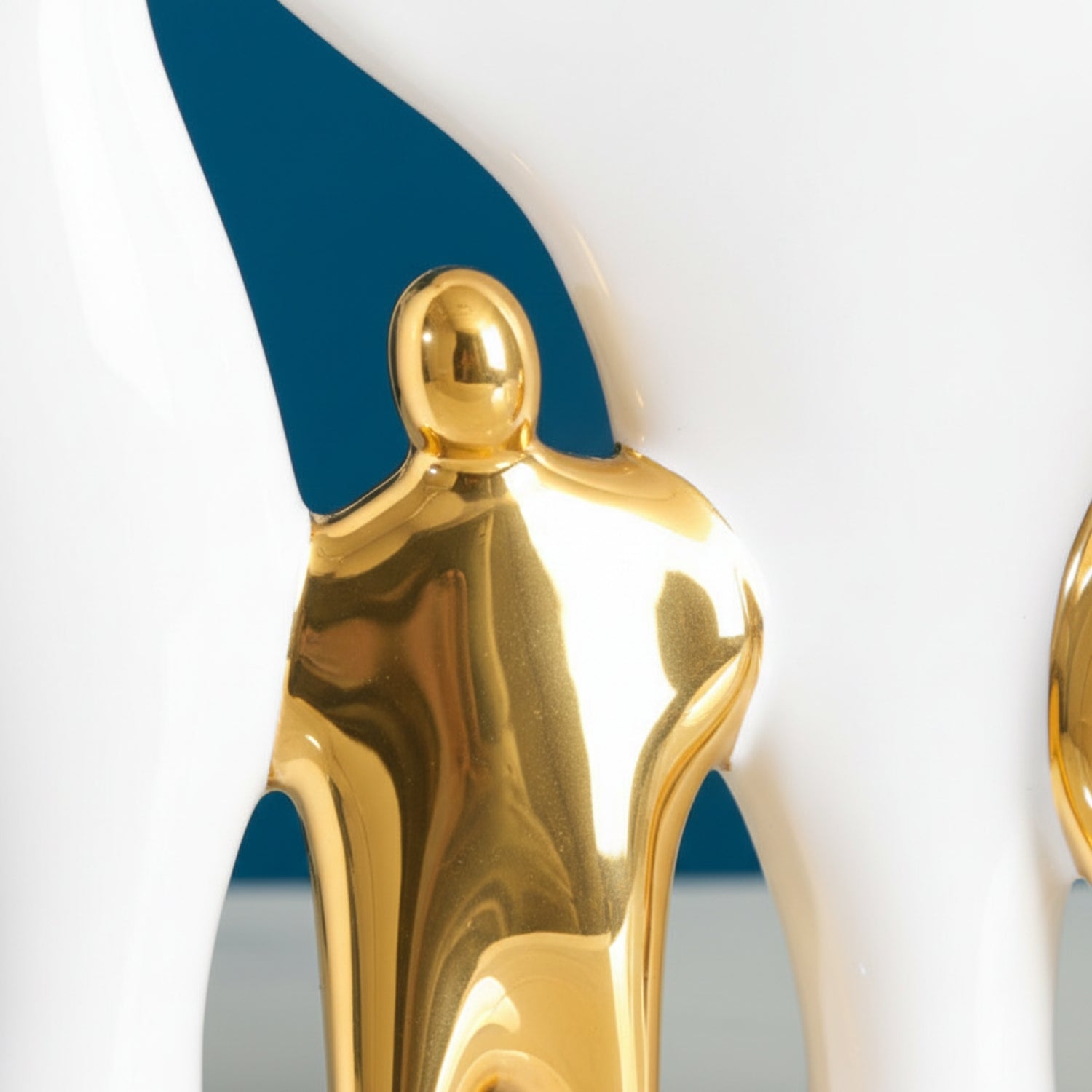 Gold decorative item with a blue accent on a white background