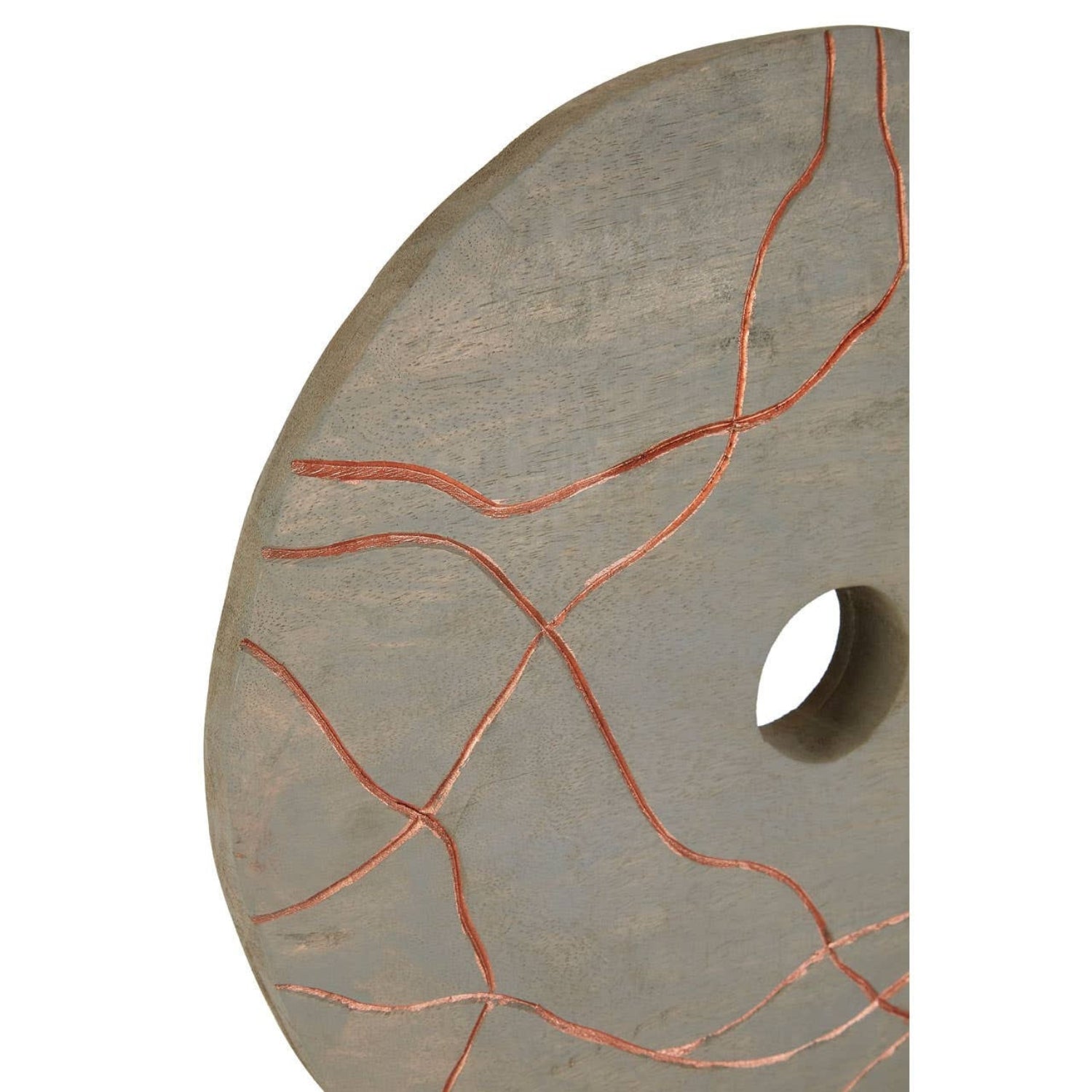 Round stone disc with a central hole and red vein-like patterns on a white background