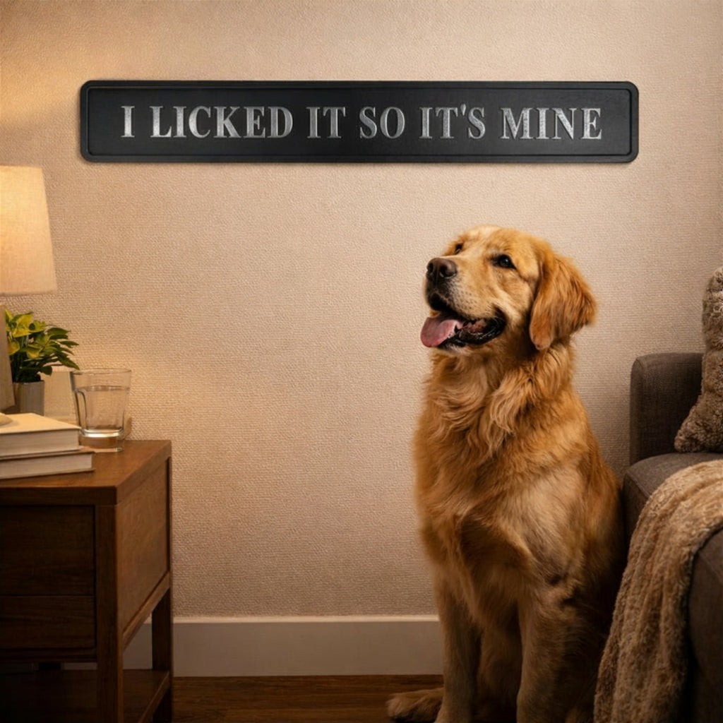 I Licked It So It's Mine sign on tile wall