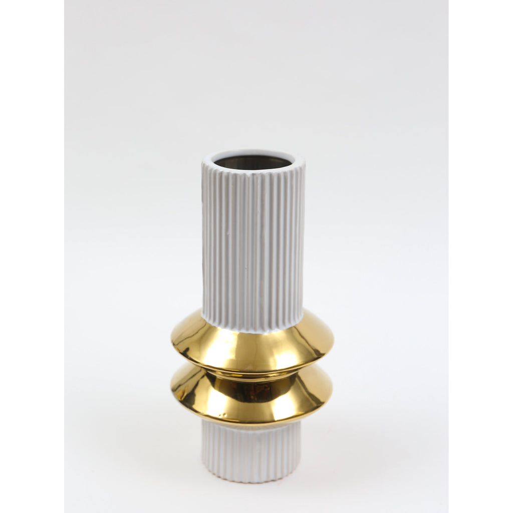 Small ribbed white vase with gold disc accent on white background