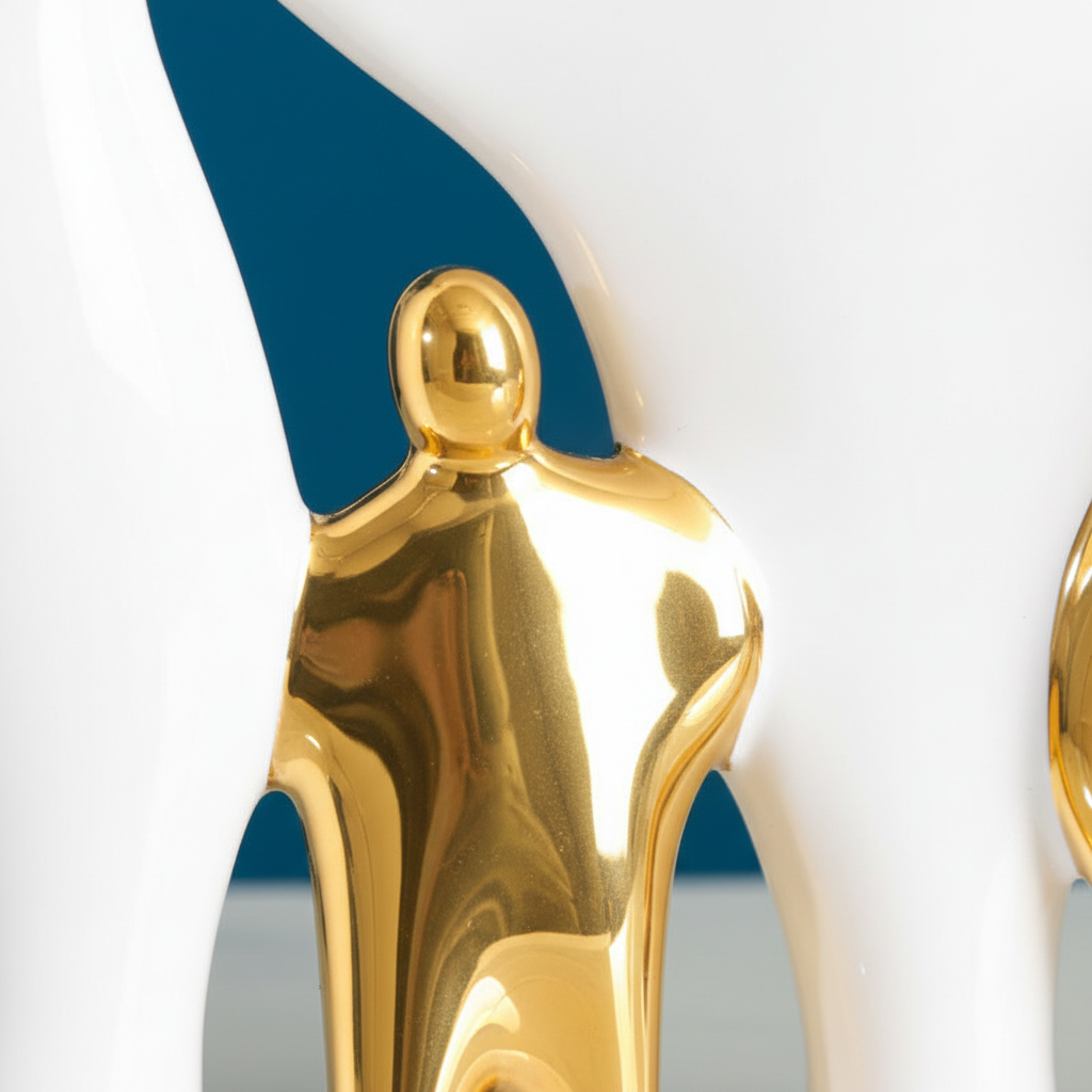 Close-up of gold child figures in family sculpture