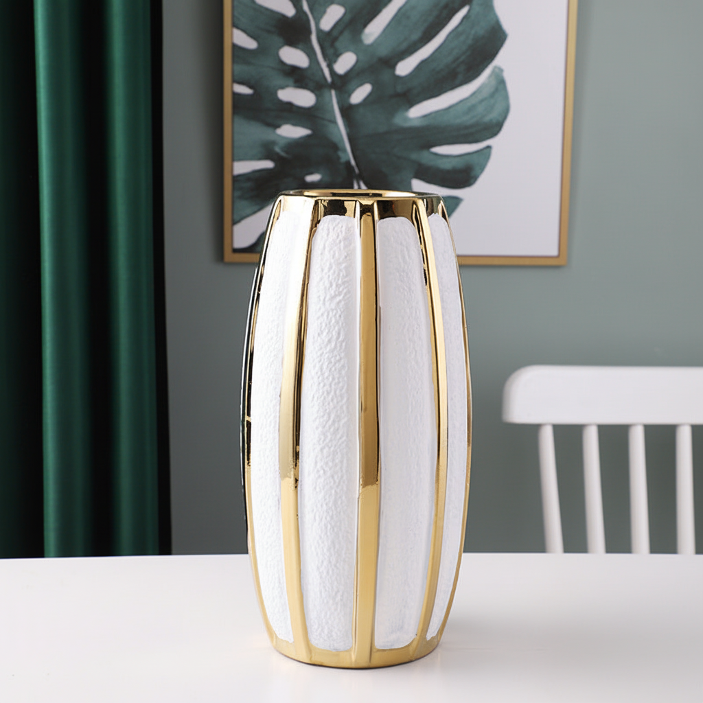 White and gold stripe tall ceramic vase on marble surface
