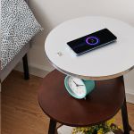 Top surface of 3-tier LED side table with wireless charging pad and phone