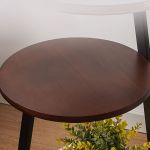 Close-up of walnut wood shelf surface on 3-tier LED side table